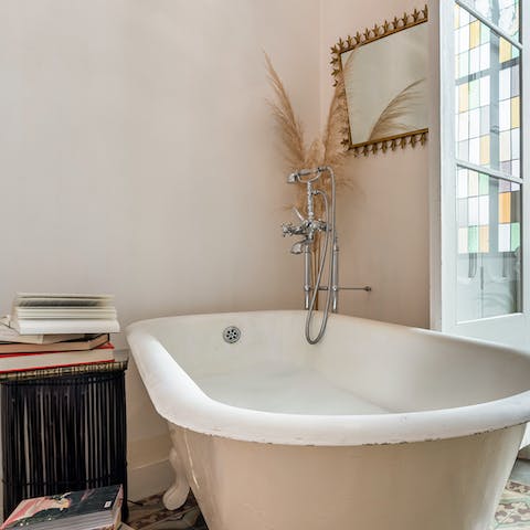 Treat yourself to a long soak in the main bedroom's clawfoot tub