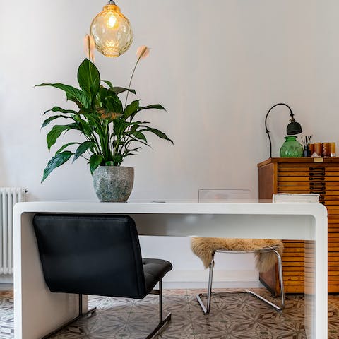Catch up on work at the living area's chic desk space