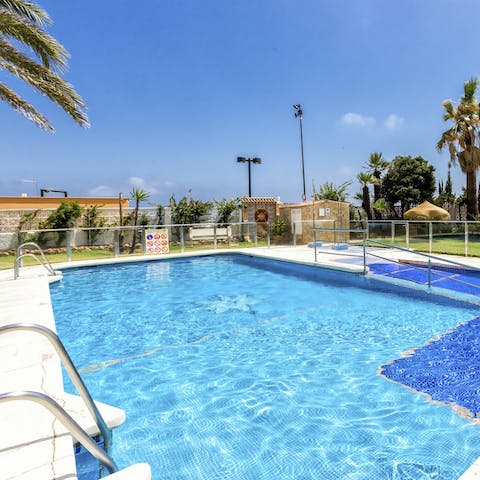 Take a refreshing dip in the communal swimming pool 