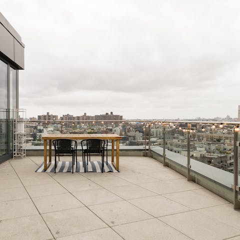 Take your tipple outside on the huge terrace with views of the Manhattan skyline