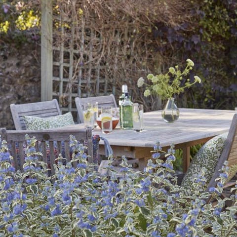 Sip a glass of wine in the pretty cottage garden, awash with lavender and other flowers