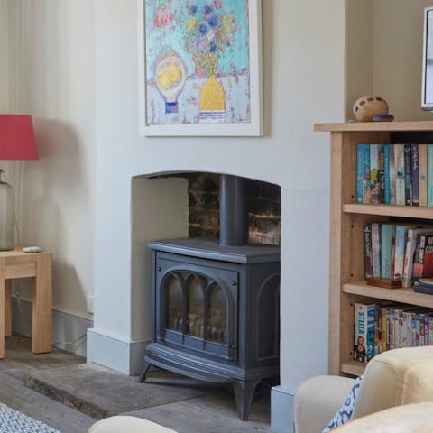 Cosy up next to the log-burning stove on chilly evenings