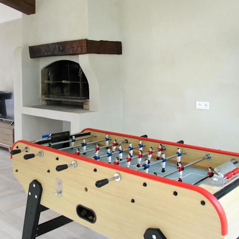 Challenge your fellow guests to a table football tournament