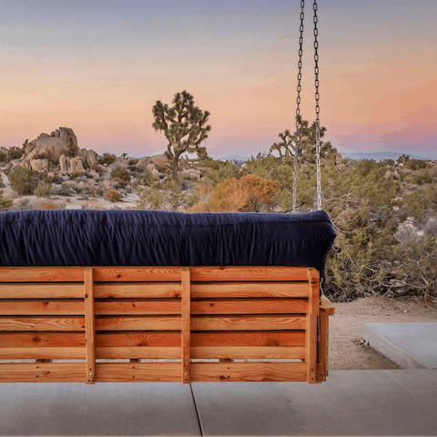 Watch the superb sunsets from the porch swing