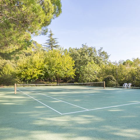 Step out onto the private tennis court for some friendly competition