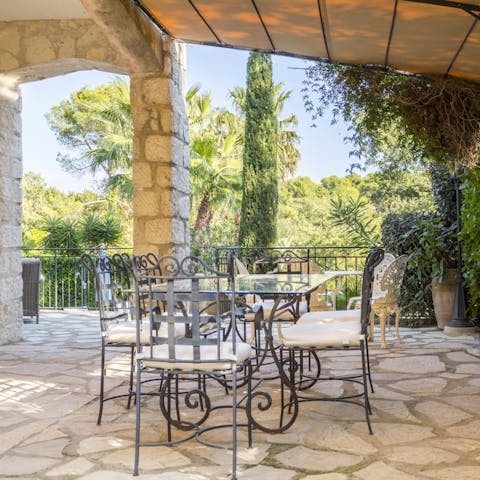 Take a seat in one of this home's gorgeous outdoor areas