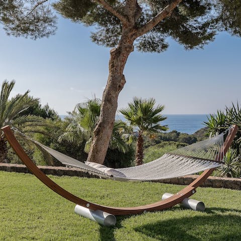 Indulge in a spot of sunbathing in the sprawling garden