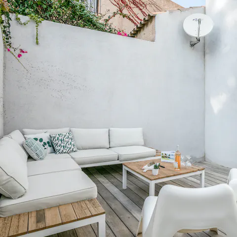 Curl up with a book on the outdoor white sofas