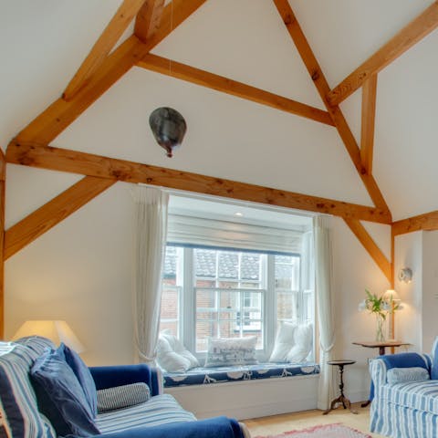 Admire the rustic, original wooden beams in the lounge