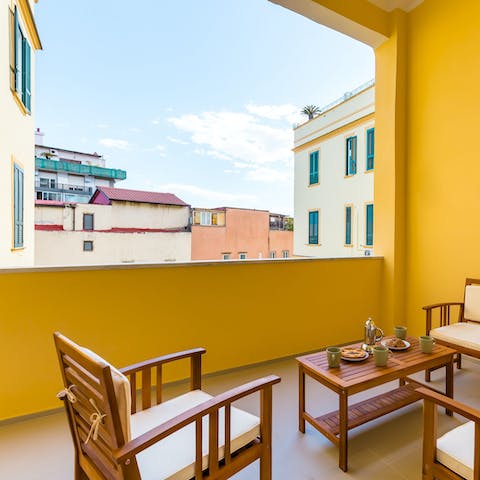 Unwind with a glass of Italian vino on the marmalade-coloured balcony
