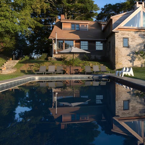 Have a dip in the private saltwater pool, surrounded by lawns and trees