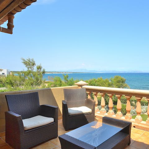 Greet the day out on your balcony, with stretching views over the bright Alcúdia Bay