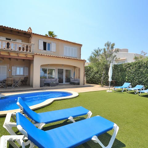 Thumb through a good book as you soak up Mallorcan sunrays by the plunge pool