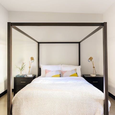 Sleep in the modern four poster bed