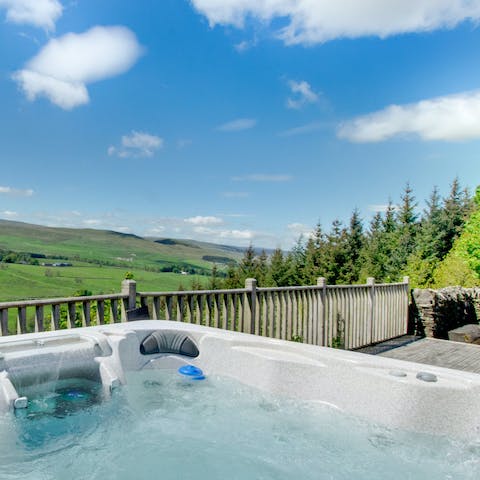 Embrace the natural elements whilst soaking in the warmth of the hot tub