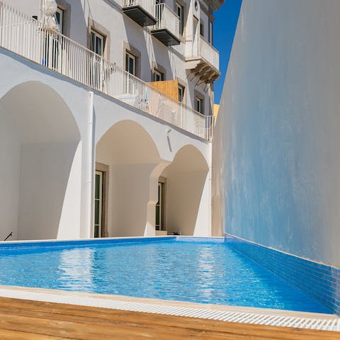 Stretch out poolside to soak up the Algarve sun