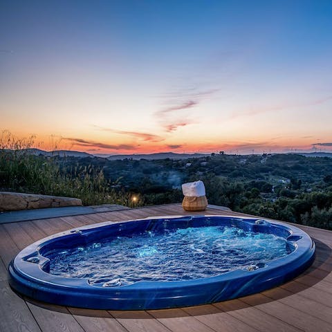 Enjoy a sunset soak in the bubbles of the hot tub