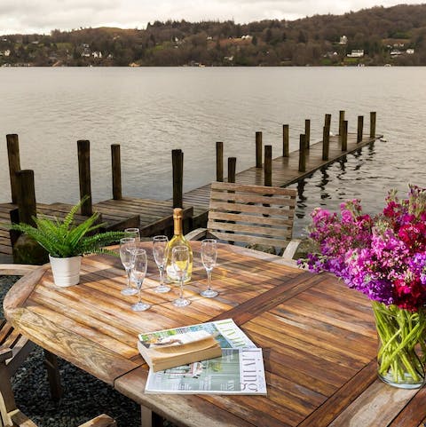 Make a toast on the terrace as you gaze out over the lake
