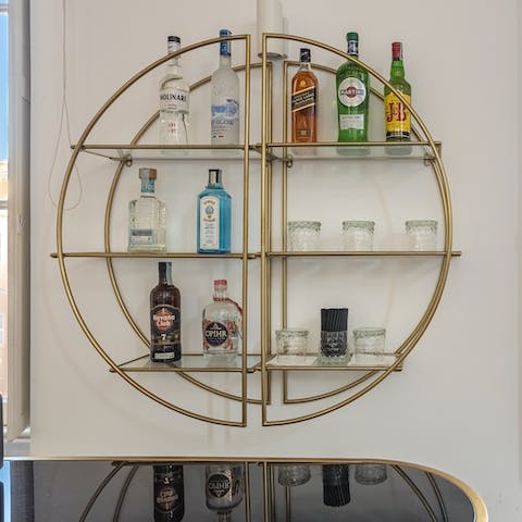 Rustle up a cocktail at the sleek little bar in the living room