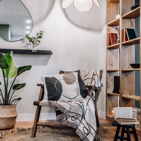 Peruse the bookshelf and relax in this nook after visiting the Museo del Romanticismo