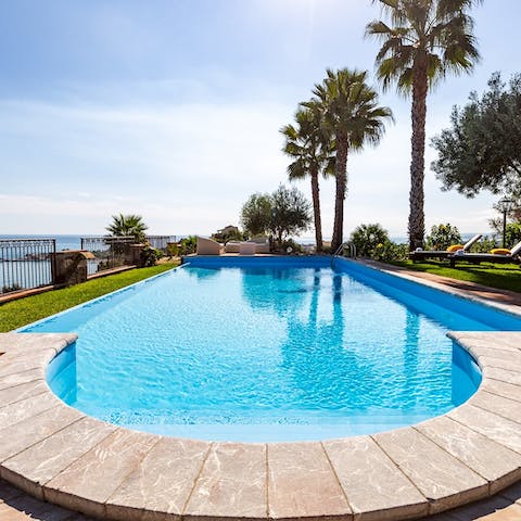 Float in the pool while taking in views of the Mediterranean Sea