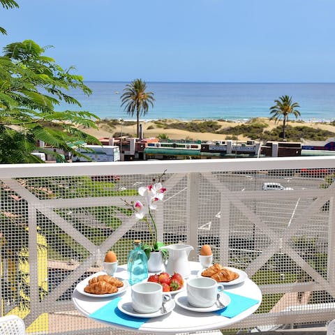 Start the day with breakfast on the balcony, watching the waves roll into shore