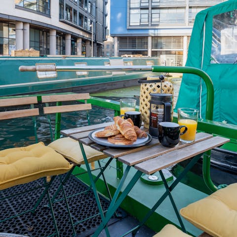 Savour your morning coffee on the roof deck of your houseboat