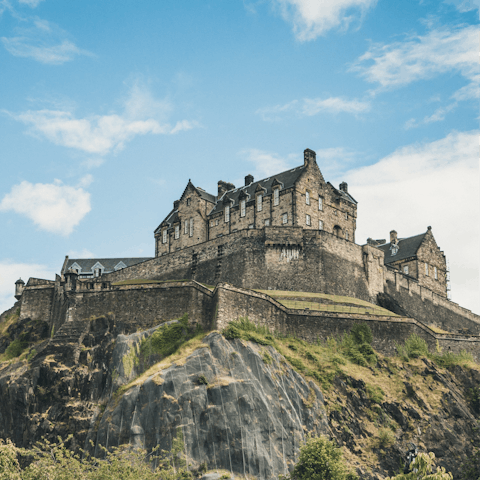 Take a fifteen-minute walk through town to visit Edinburgh Castle, on its extinct volcano