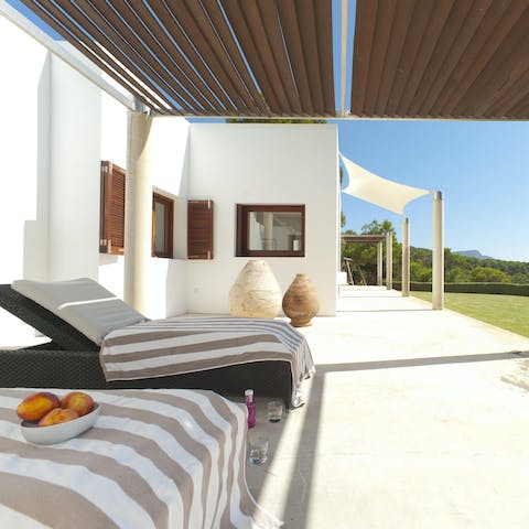 Relax with your favourite book on the shaded day beds
