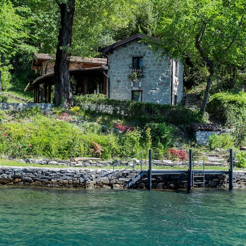 Disconnect from the noise of modern life at this stunning lakeside home, only accessible from the water
