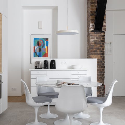 Admire design features like mid-century furniture, modern art and exposed brick