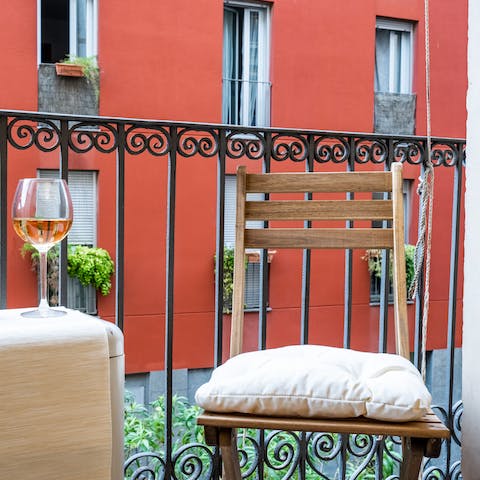 Sip on a glass of red on your very own balcony