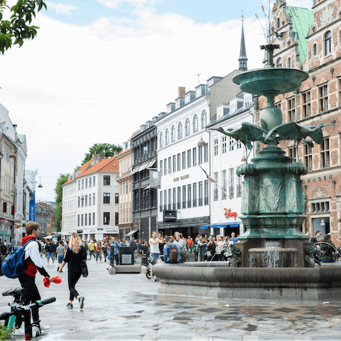 Treat yourself to some retail therapy along Strøget, a twelve-minute walk away