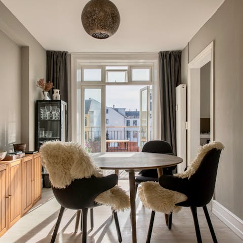 Sit down to a celebratory meal in the cosy, Scandi dining room