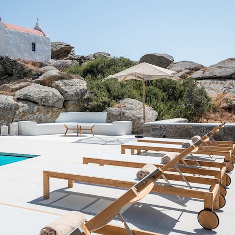 Settle in for a day of sunbathing by the private pool