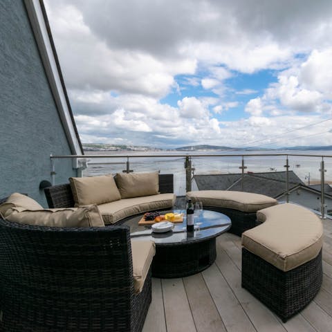 Admire the sea views over a glass of wine outside on the deck 