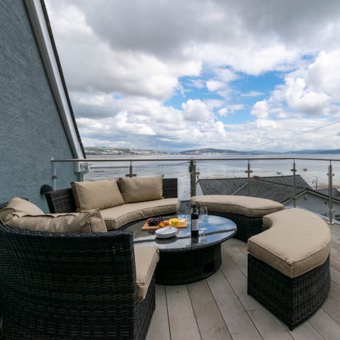 Admire the sea views over a glass of wine outside on the deck
