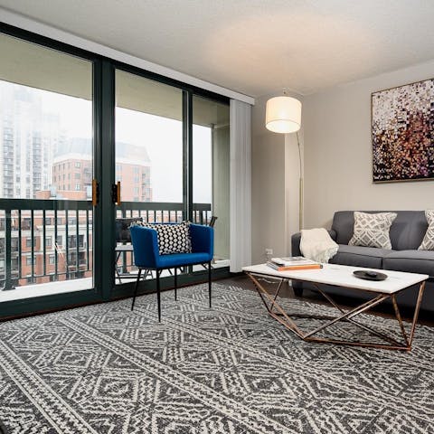 Relax and enjoy the views from the apartment’s floor-to-ceiling windows