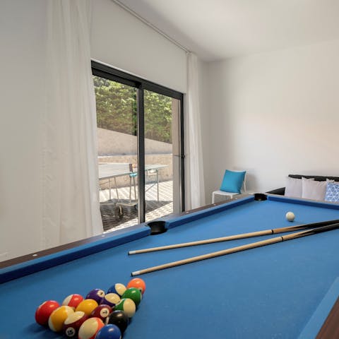 Enjoy a spot of pool in the private games room