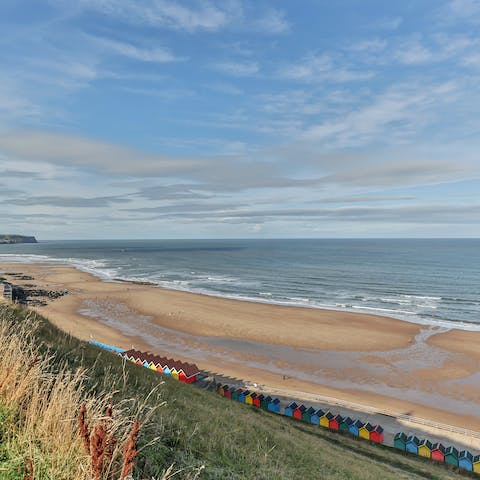 Sink your toes in the sand at Whitby Seafront, under ten minutes away on foot