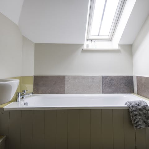 Soak in the tub beneath the skylight after a day of rambling through the countryside