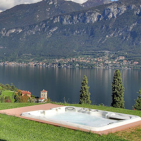 Sip a glass of bubbly in the hot tub as the sun sets over the lake