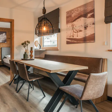 Gather for a family meal around the leather and wood dining table