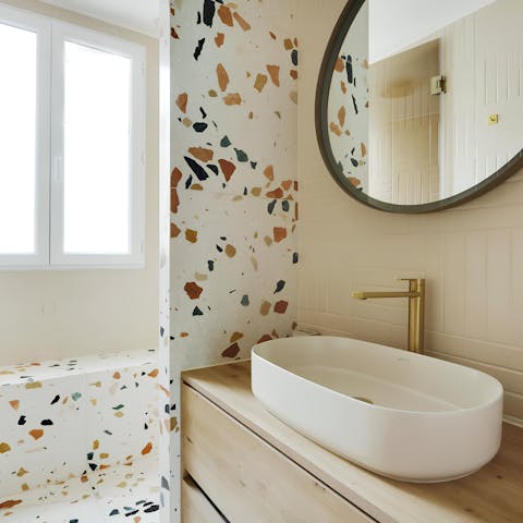 Get ready in the colourful bathroom for an evening out in Paris