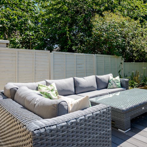 Enjoy sunset drinks together on the outdoor patio sofas