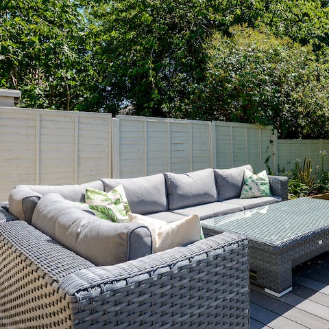 Enjoy sunset drinks together on the outdoor patio sofas