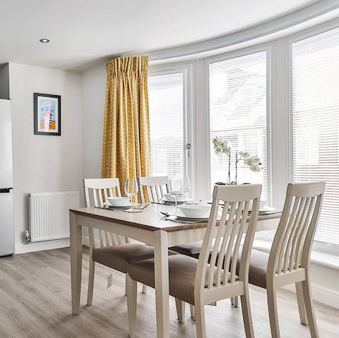 Come together for lazy mealtimes in the light-filled dining space