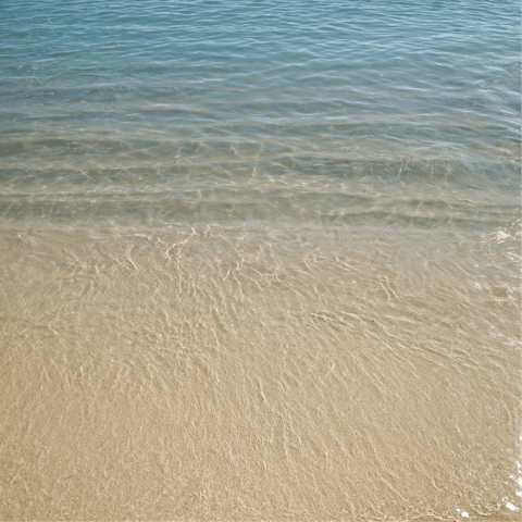 Let the crystal clear waters of Honu Lagoon wash over you