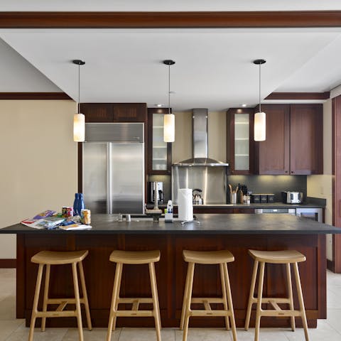 Tuck into the welcome goodies at the sleek breakfast bar
