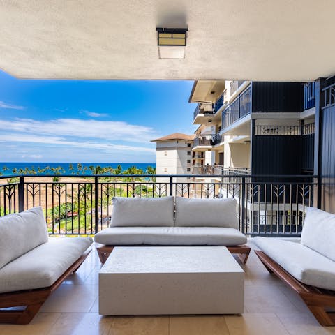 Take in views of the beach and the Pacific while sipping a cocktail on your private balcony